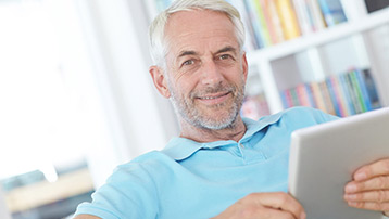 Man completing his new patient questionnaire from the comfort of home